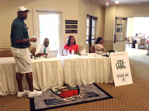 Wendell Haskins on laptop with green tie_500