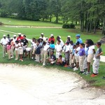 Kids observing instruction  about bunker play with Instructor Isiac Dukes.